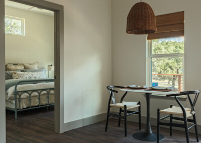 dining room with small table and lamp above