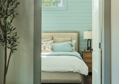 door open to a bedroom with a bed in it
