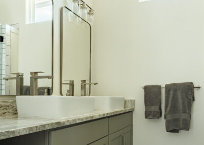 white bathroom with mirros on the wall