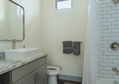 white bathroom with white tile
