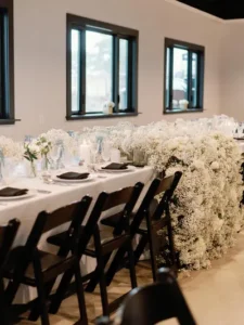 wedding reception tables set up at an indoor outdoor wedding venue in texas