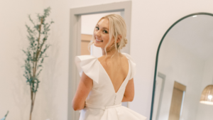 bride in her wedding dress looking back at the camera