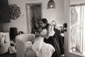 bride hugging her mom in her bridal suite