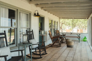 texas charm porch with rocking chairs at hawkins hope ranch